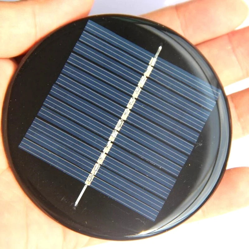 0.5W 80mm round solar module — round module held for scale
