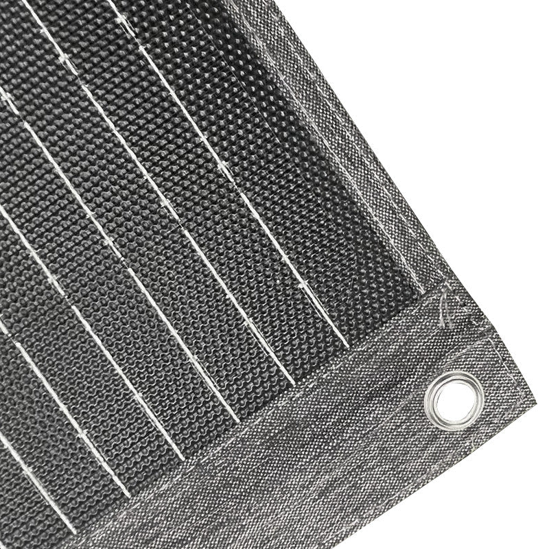 Close-up of solar cells and reinforced corner eyelet on 100W fabric panel