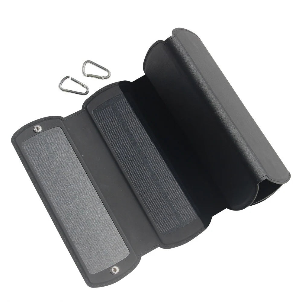16W foldable solar charger — partly opened panel and carabiners