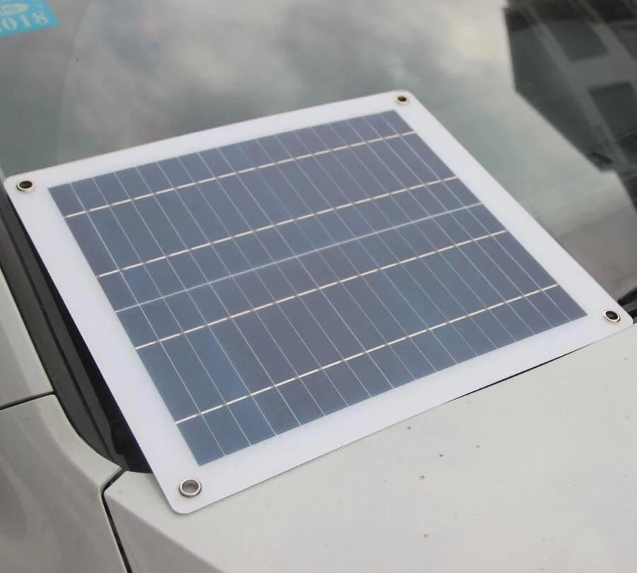 Solar panel positioned at a vehicle windscreen