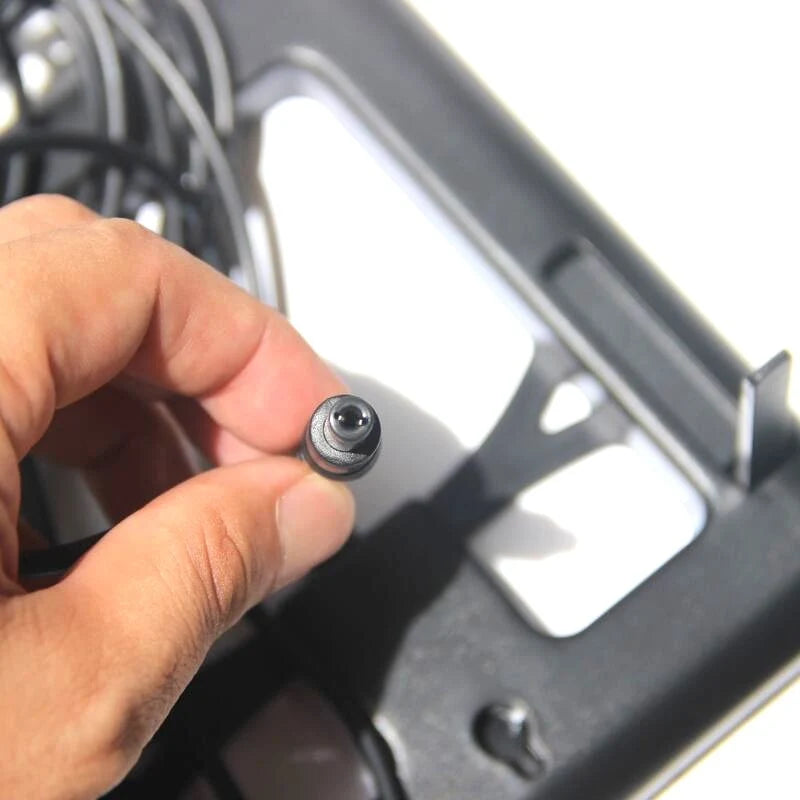 2W glass solar panel — DC barrel connector close-up