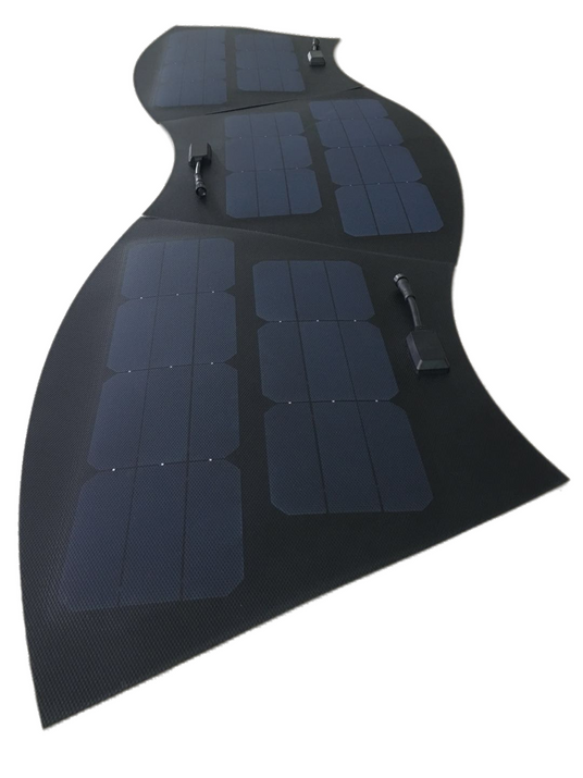 A wavy, partially folded black solar blanket with multiple sections of solar cells and junction boxes, isolated on a white background.