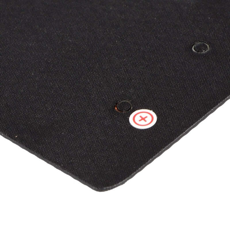 Back corner close-up showing screw hole and red positive (+) marker.