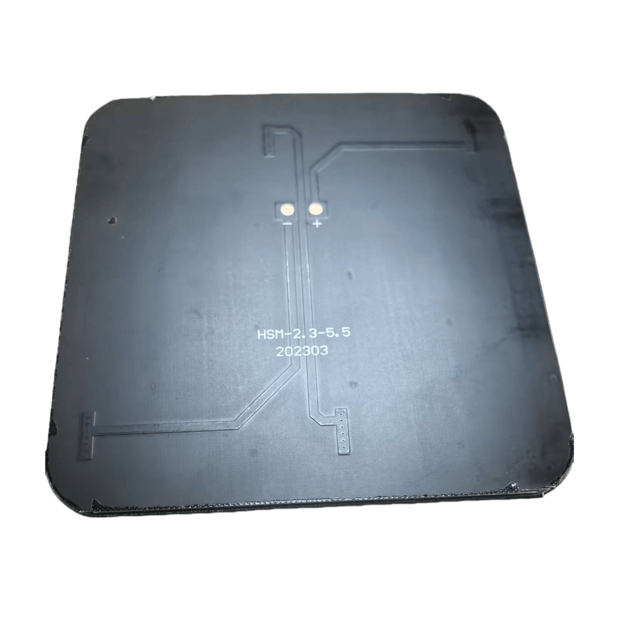 Back side of the mini panel showing two solder pads and PCB traces.