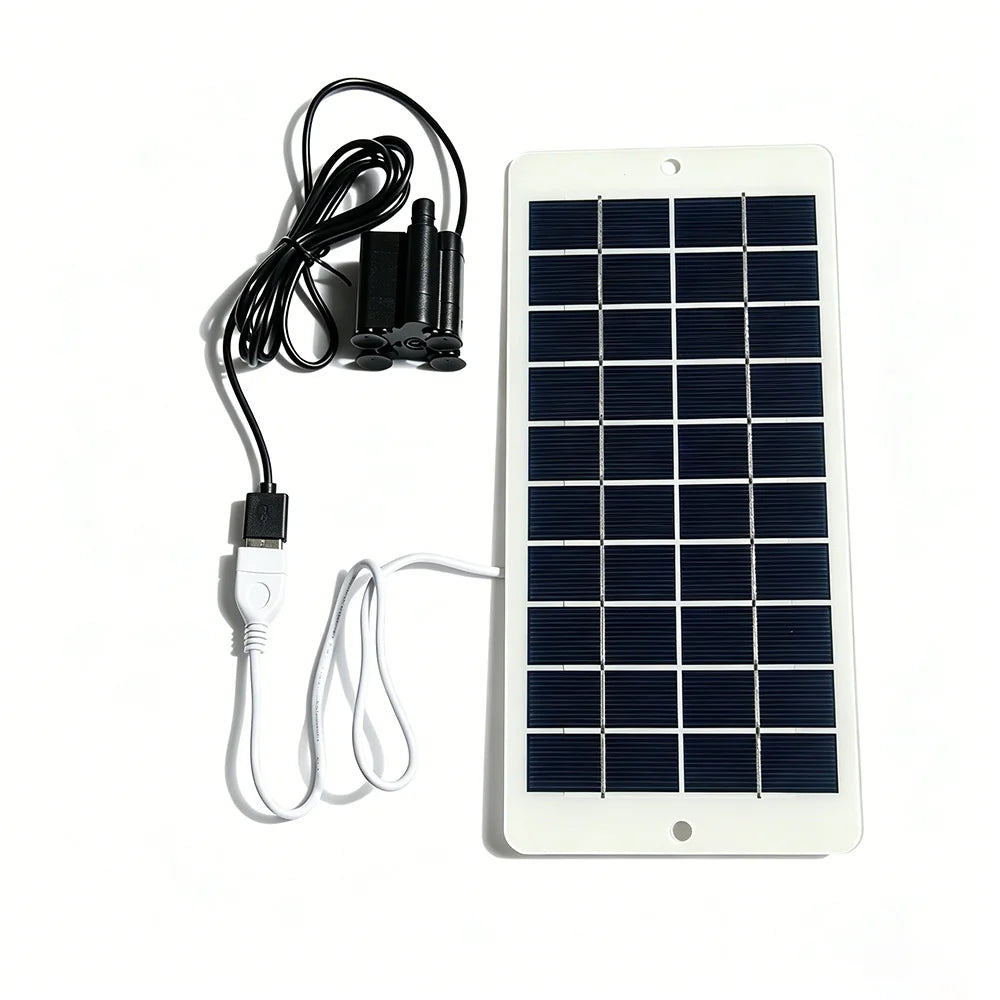Black USB water pump connected to the white solar panel