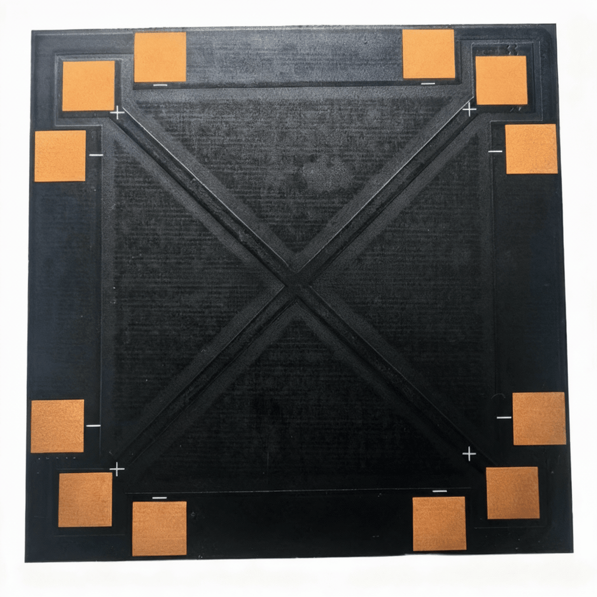 Back of panel with eight copper pads around the edges and PCB “X” stiffener.