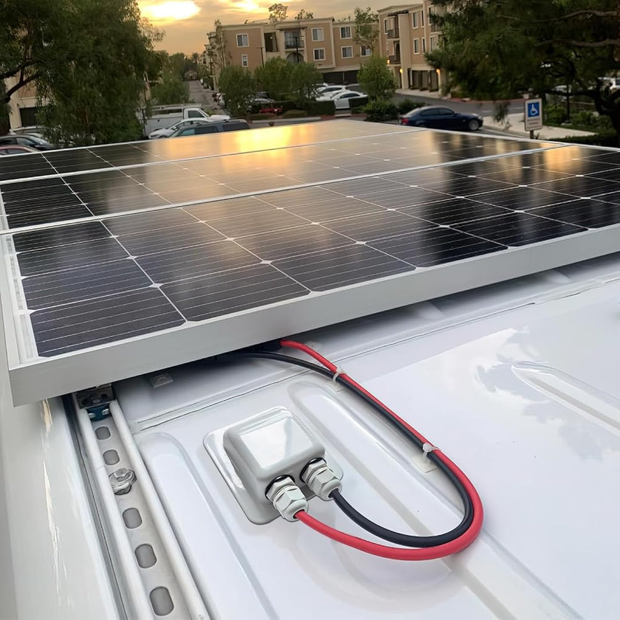 White solar cable entry gland on RV roof solar installation
