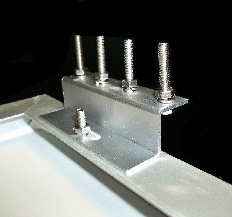 Z-bracket installed on a panel frame with bolts and nuts, side view.