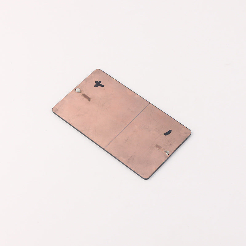 Back view of mini solar panel showing soldered contact points