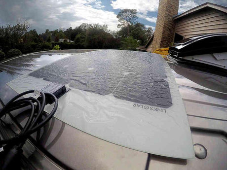 Flexible LinkSolar solar panel installed on top of a van roof
