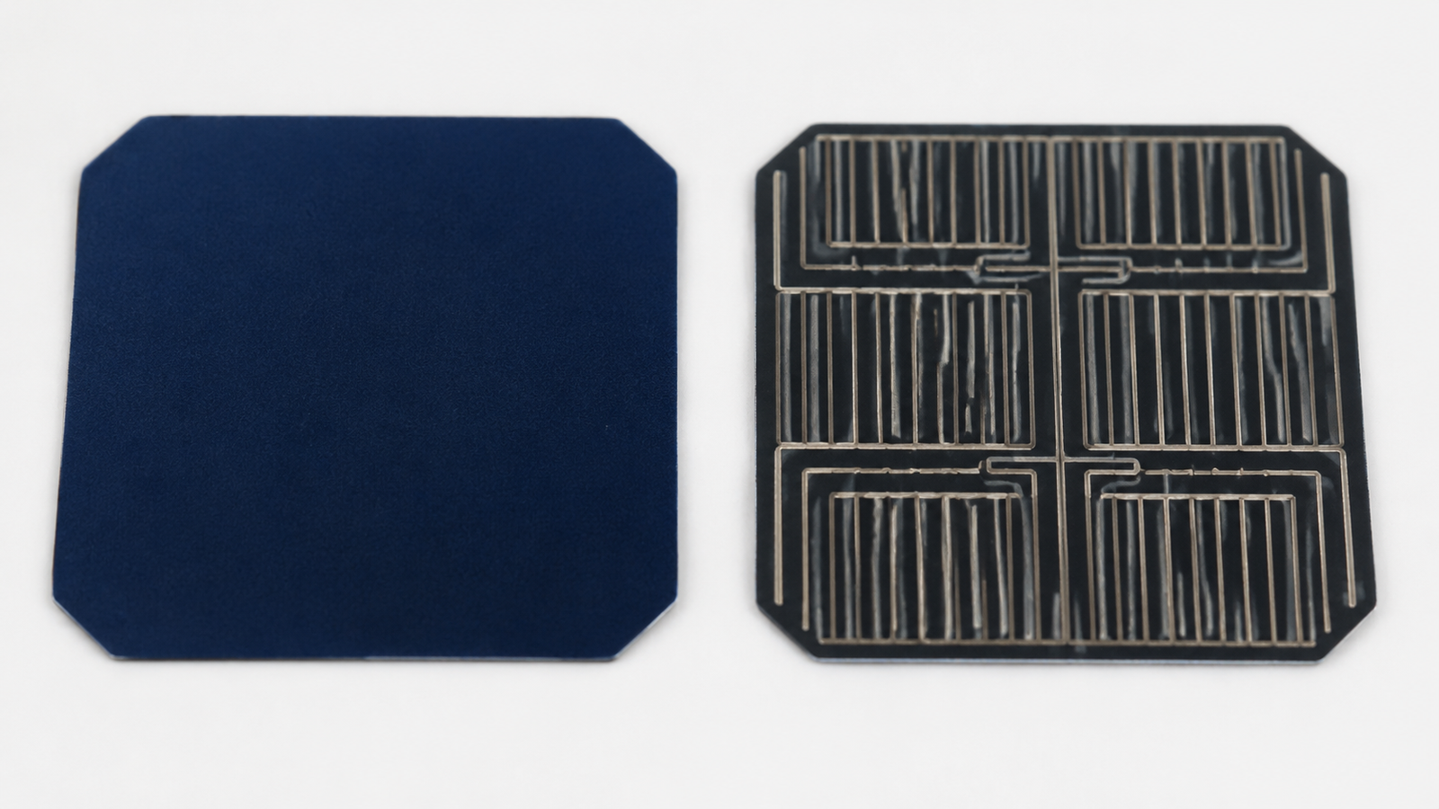 Close-up of SunPower IBC solar cell showing uniform front surface with no gridlines and rear contact pattern on clean white background