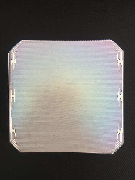 Rear face of a back-contact solar cell showing the interdigitated metal contacts