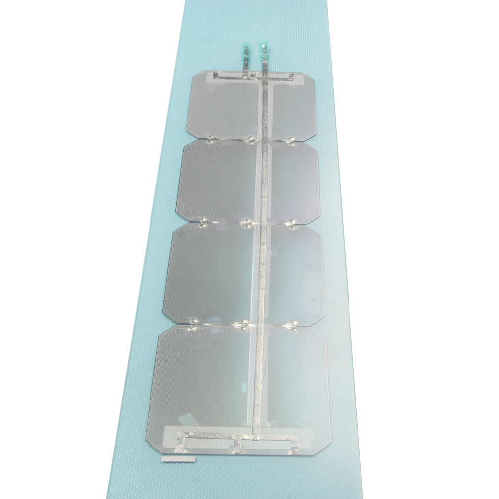 Interconnected solar cell string on light blue backing strip