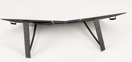 Rear of a folding solar panel showing two fabric support legs with black retaining straps