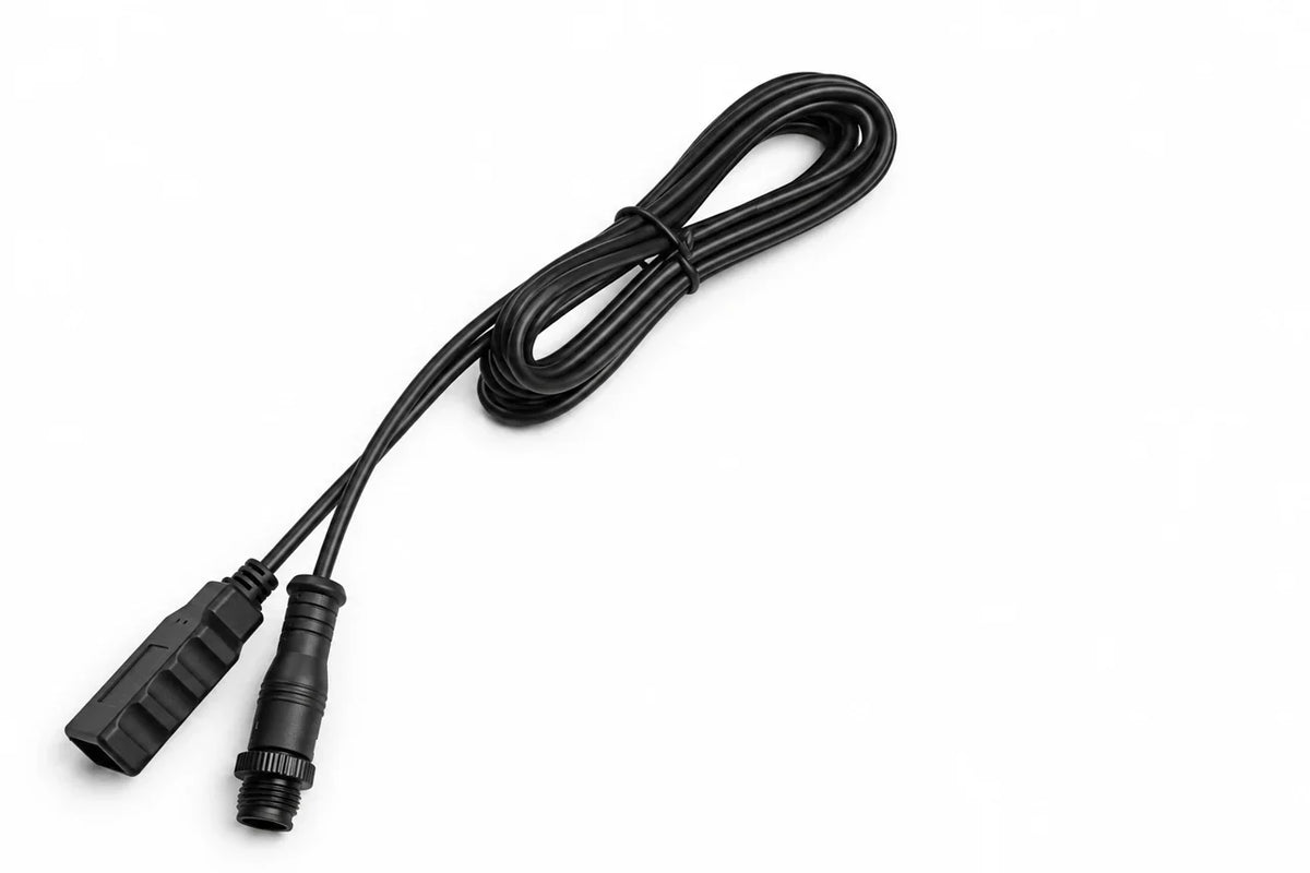 AI-retouched user photograph: Coiled adapter cable with a USB-style end and a threaded cylindrical connector