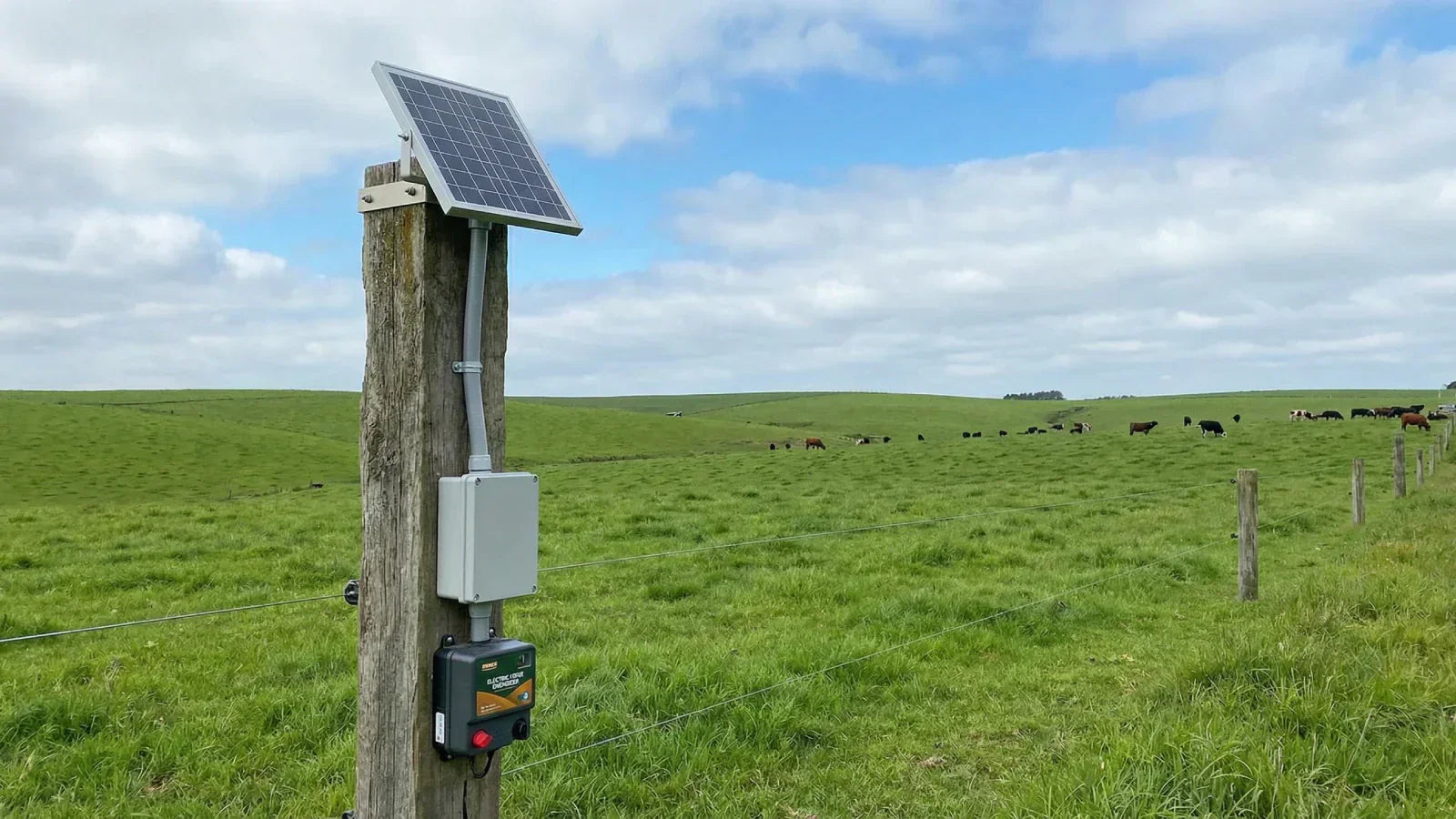 Complete solar electric fence system with panel battery and energizer on pasture post