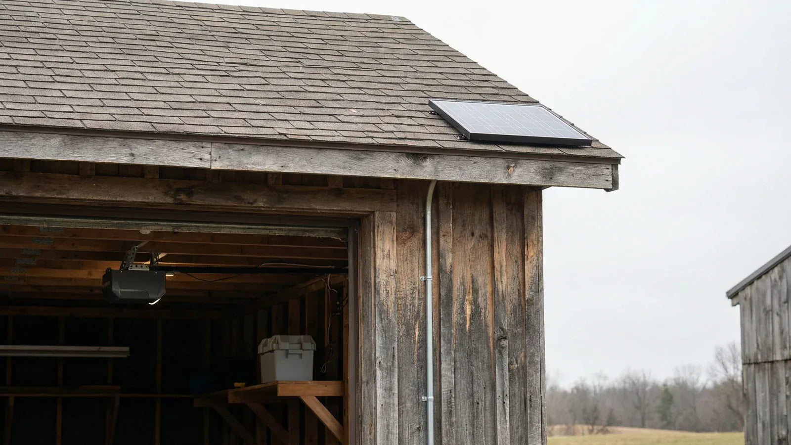 Detached garage with 12W solar panel mounted on roof for door opener