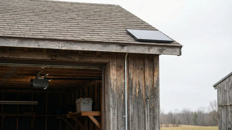 Detached garage with 12W solar panel mounted on roof for door opener
