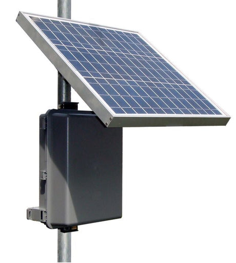 Small framed solar panel and equipment enclosure clamped to a round steel pole