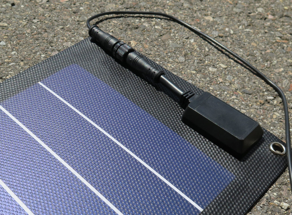 Sealed junction box and waterproof in-line connector on a small solar panel