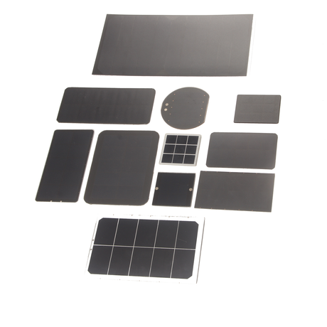 Eleven mini solar panels of different sizes and shapes laid out on a white background, from a small square to a long rectangle
