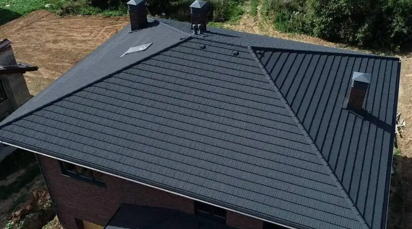 Installation example of charcoal grey solar roof tiles on a residential house roof