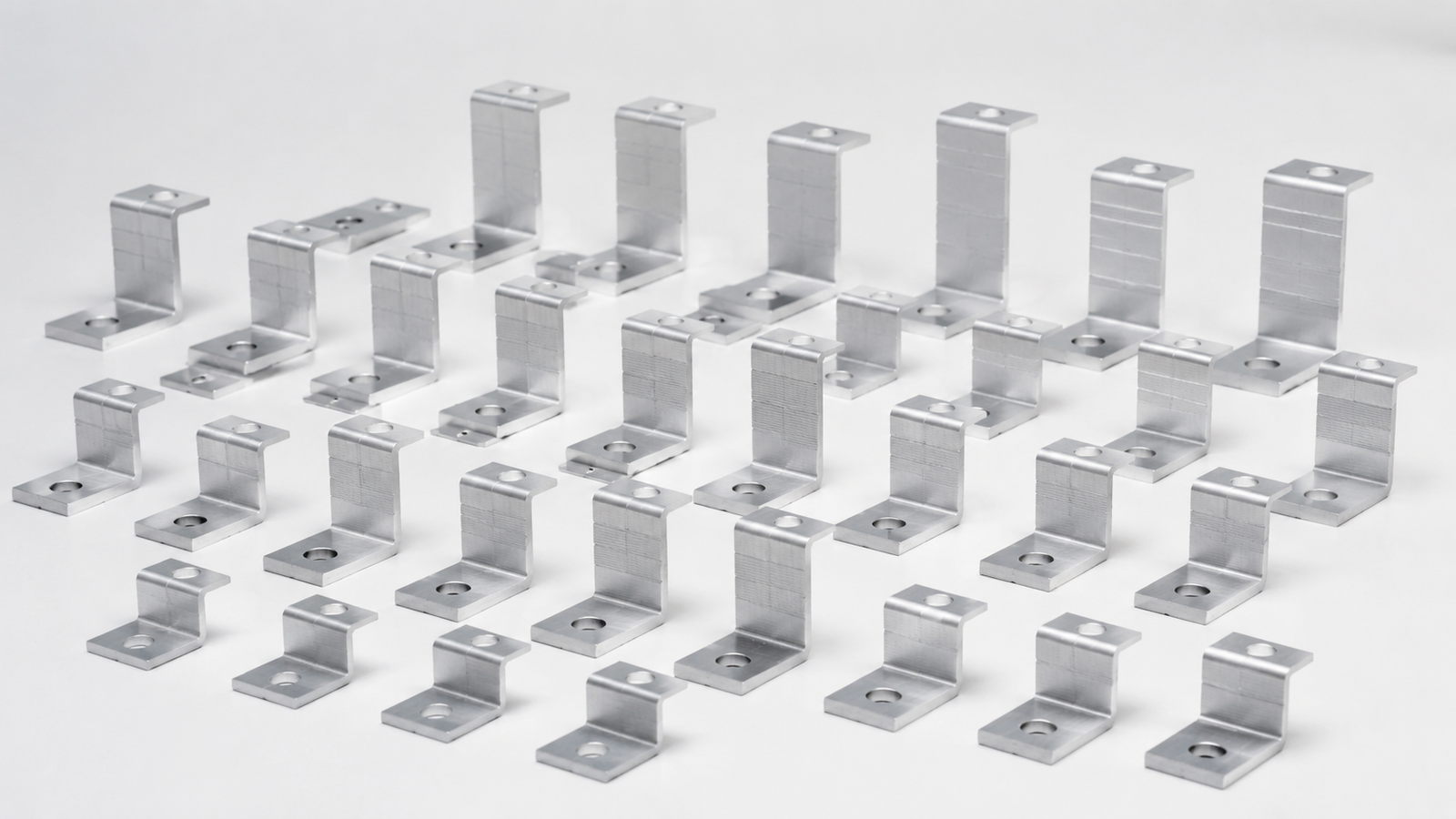 Neatly arranged compact aluminum Z-shaped solar panel mounting brackets in multiple sizes