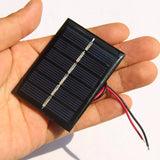 0.3W mini solar panel — panel held in hand
