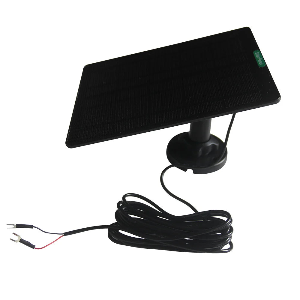 Black solar panel with coiled lead and two fork terminals