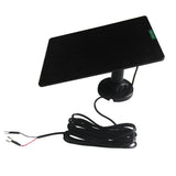Black solar panel with coiled lead and two fork terminals