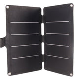 Foldable solar charger standing open in a tent-style position, matte surface.