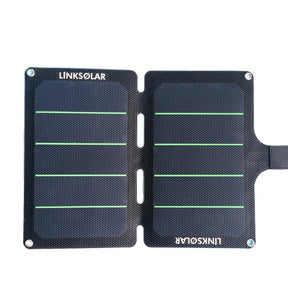 11W foldable charger unfolded flat; dual panels with alignment slots and corner eyelets.