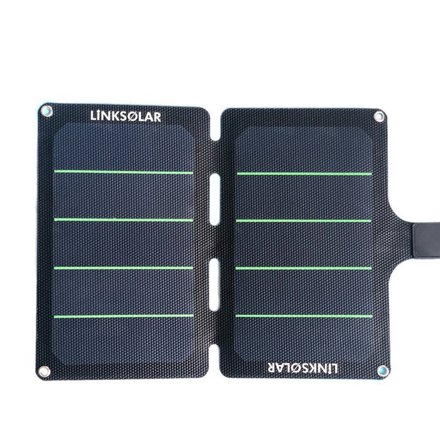 11W foldable charger unfolded flat; dual panels with alignment slots and corner eyelets.