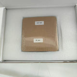 Shipping pack of full 125 mm back-contact solar cells: one shrink-wrapped bundle labelled 125*125 and 30 pcs, seated in a foam-lined white carton