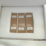 One-third-cut 125 mm back-contact solar cells packed as three separate bundles labelled 125 -- 1/3, 2/3 and 3/3, each 10 pcs, in a foam-lined carton