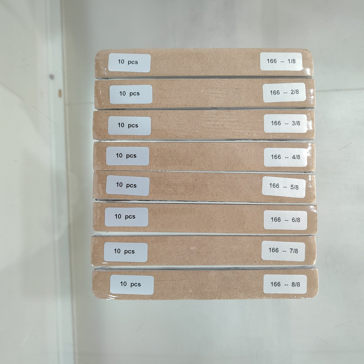 All eight strip positions from one-eighth-cut 166 mm back-contact solar cells, each bundle separately labelled 166 -- 1/8 through 8/8 at 10 pcs