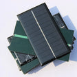 1W 1W mini solar panel — small rectangular panels front and rear