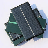 1W 1W mini solar panel — small rectangular panels front and rear