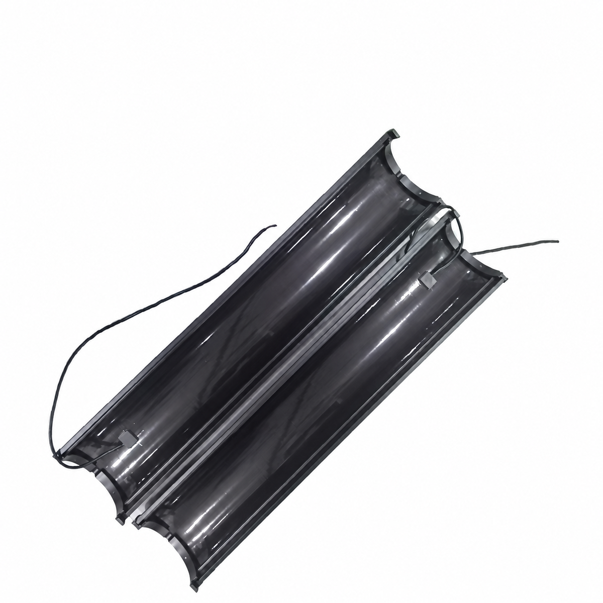 Two curved solar module halves with attached electrical leads