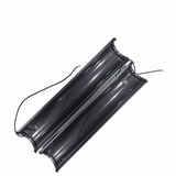 Two curved solar module halves with attached electrical leads