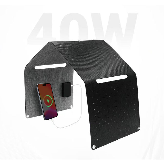 Black folding solar panel with a phone connected to the output box
