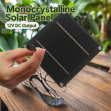 4W solar panel — DC socket and panel held in hand