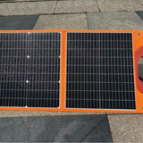 Orange-edged 60W two-section solar panel deployed outdoors