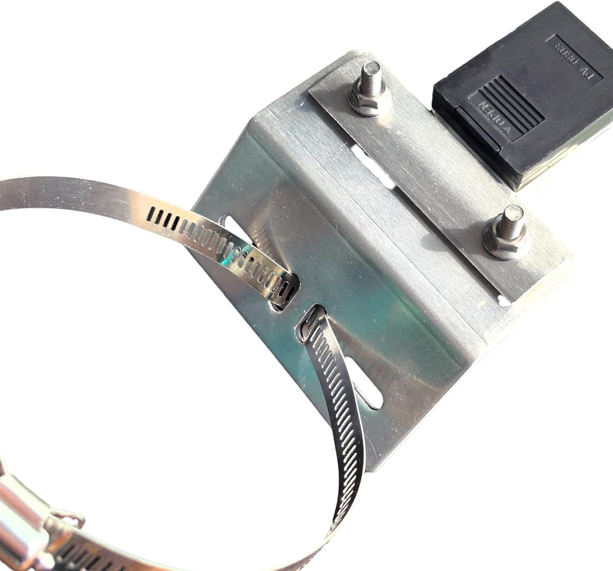 Close-up of the band clamp threaded through the bracket with fasteners installed.