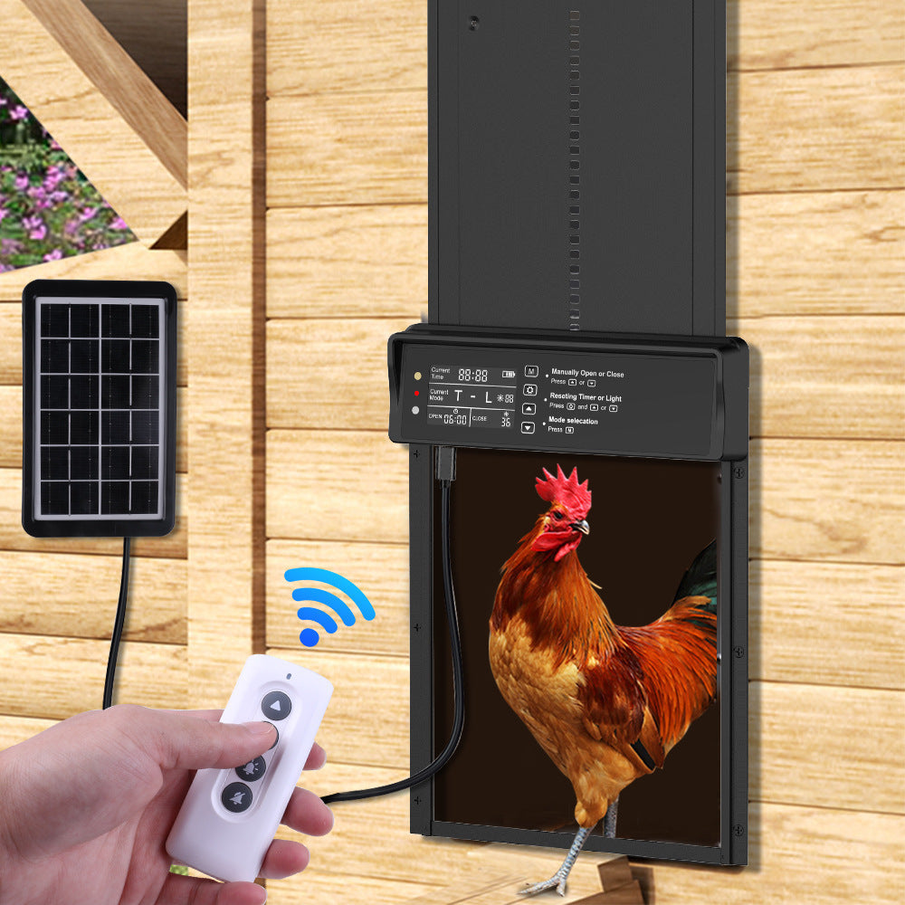 Handheld remote beside an installed black coop door and separate solar panel