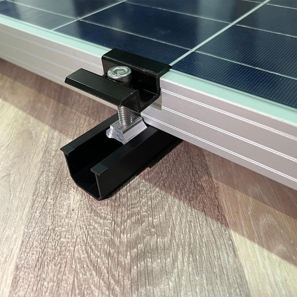 Black solar panel mounting rails installed on a roof