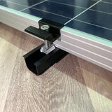 Black solar panel mounting rails installed on a roof