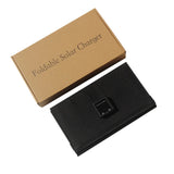 Folded solar charger beside its plain box