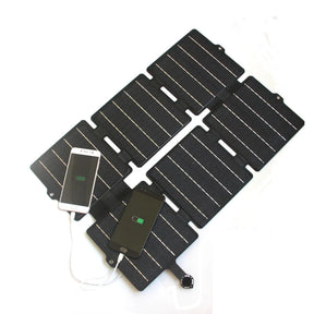 30W ETFE Six-Fold Solar Charger in Black or Blue — black charger powering phone