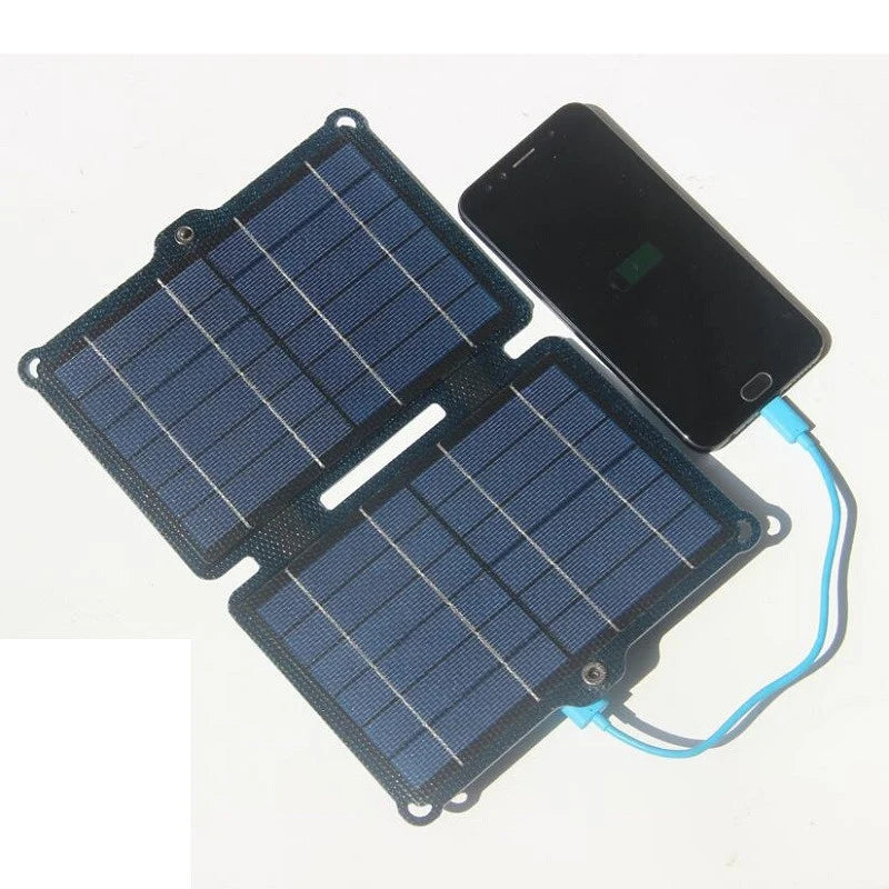 Two-section panel shown charging a phone